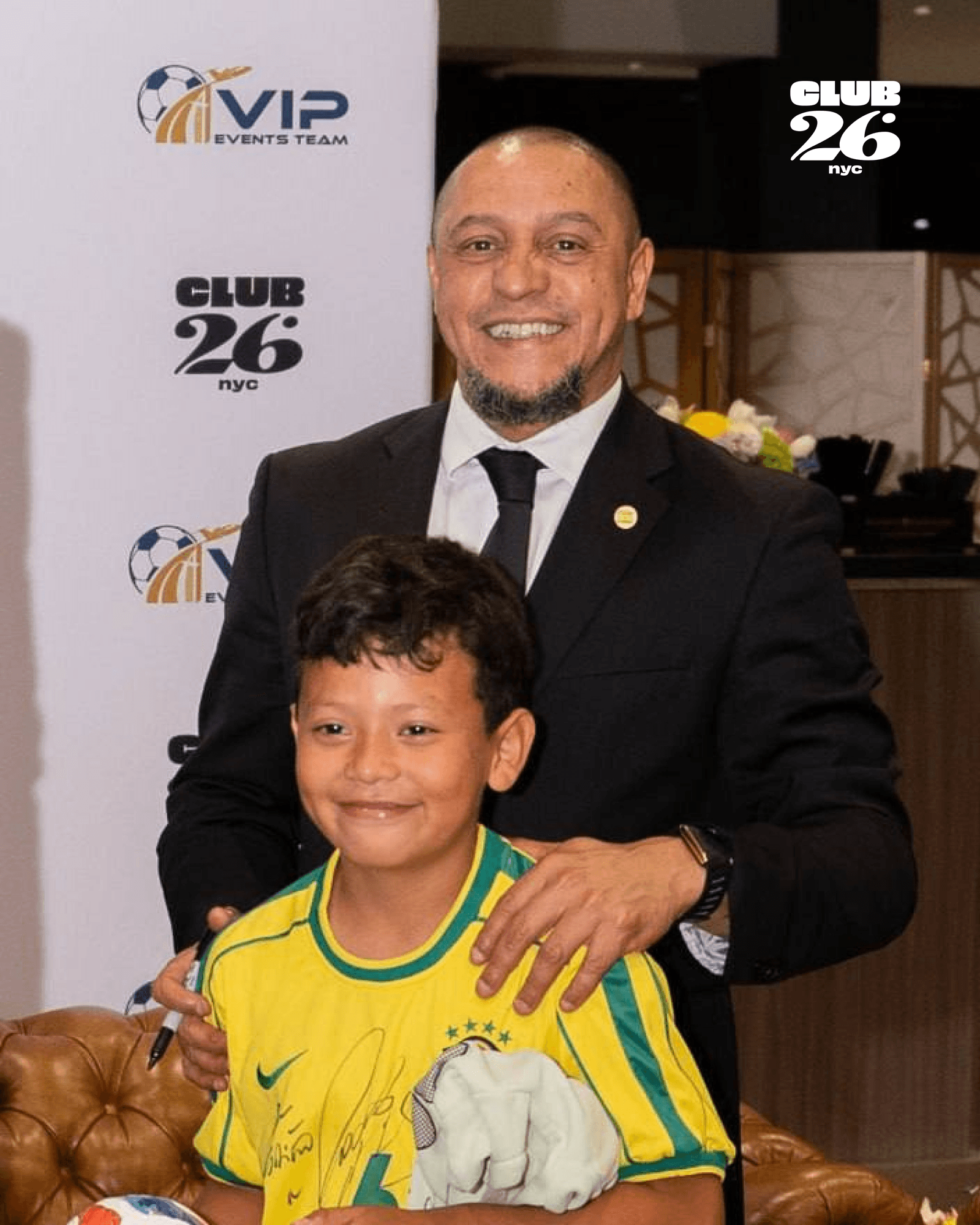 Football legend with a young fan at a previous CLUB 26 event